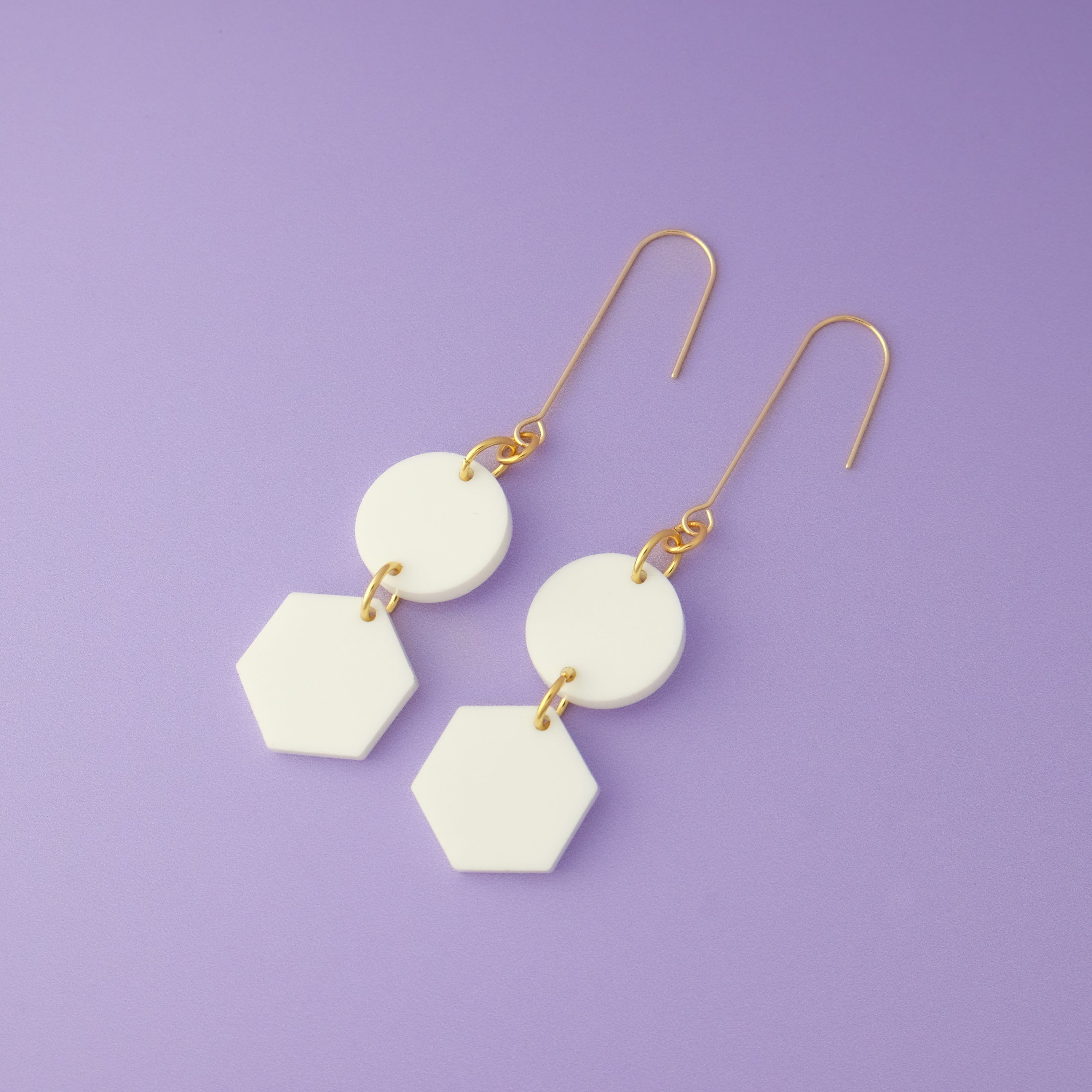 Elegant, elongated and lightweight Belle Dangles geometric dangly earrings in matte white #color_white