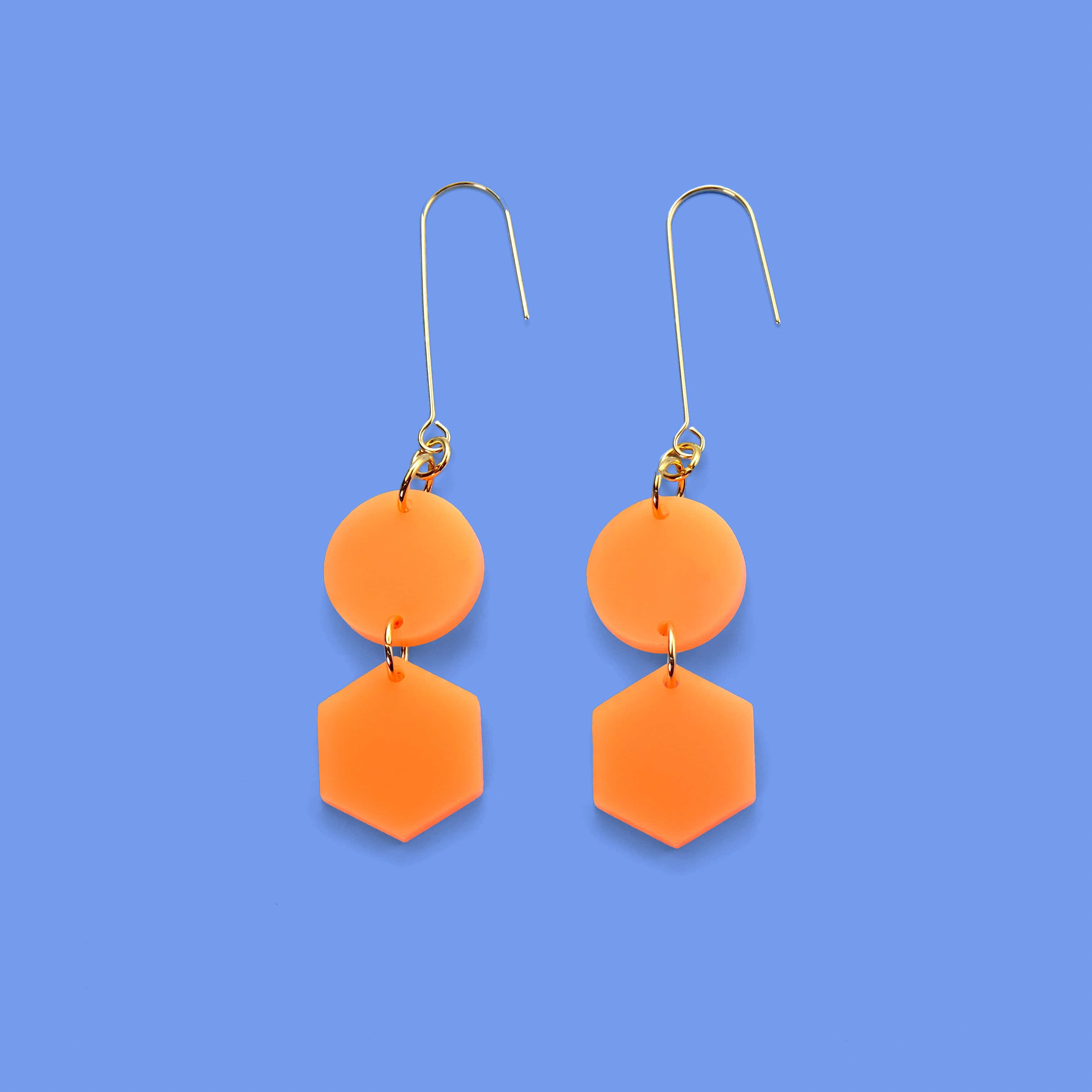 Elegant, elongated and lightweight Belle Dangles geometric dangly earrings in bright neon orange #color_neon-orange