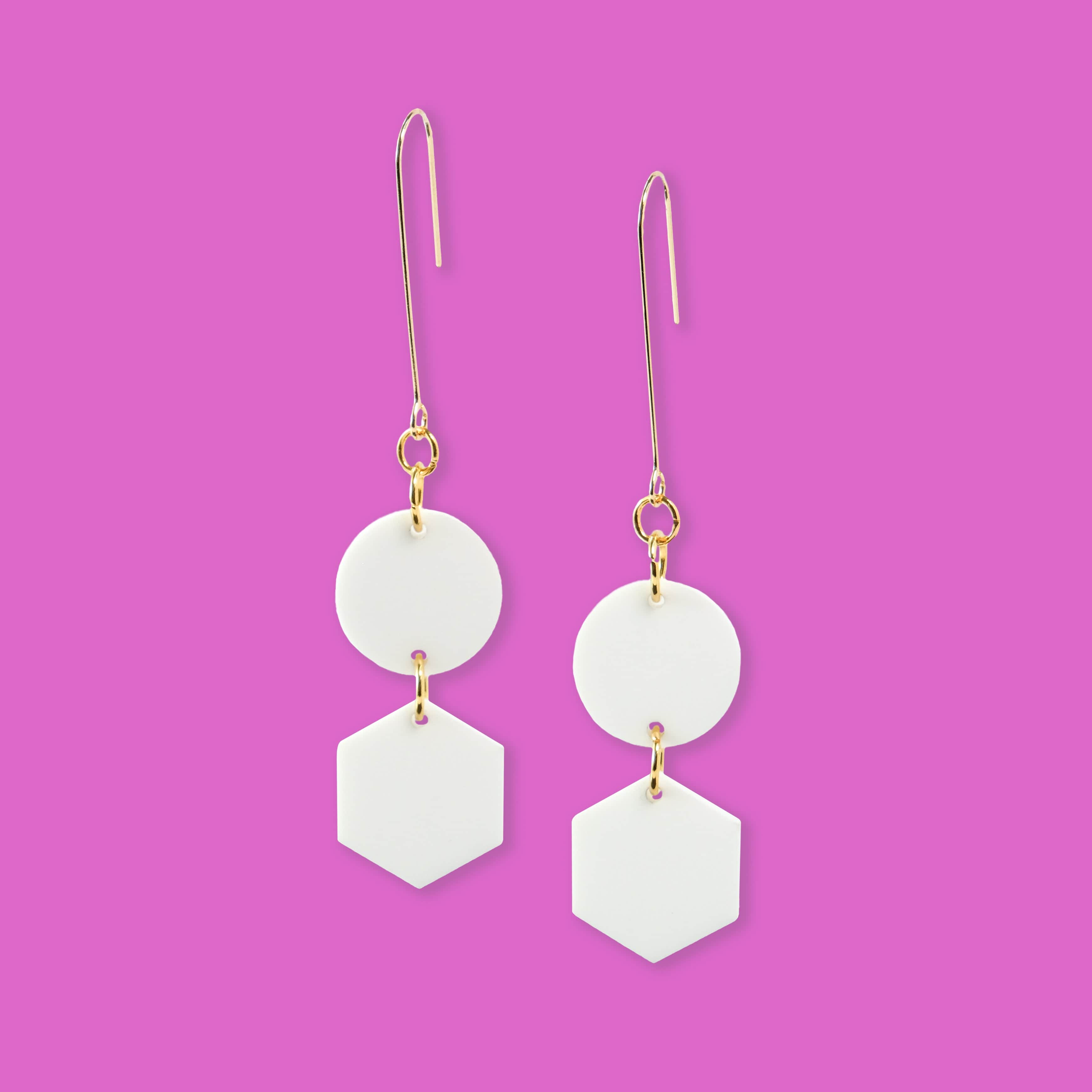 Elegant, elongated and lightweight Belle Dangles geometric dangly earrings in matte white #color_white