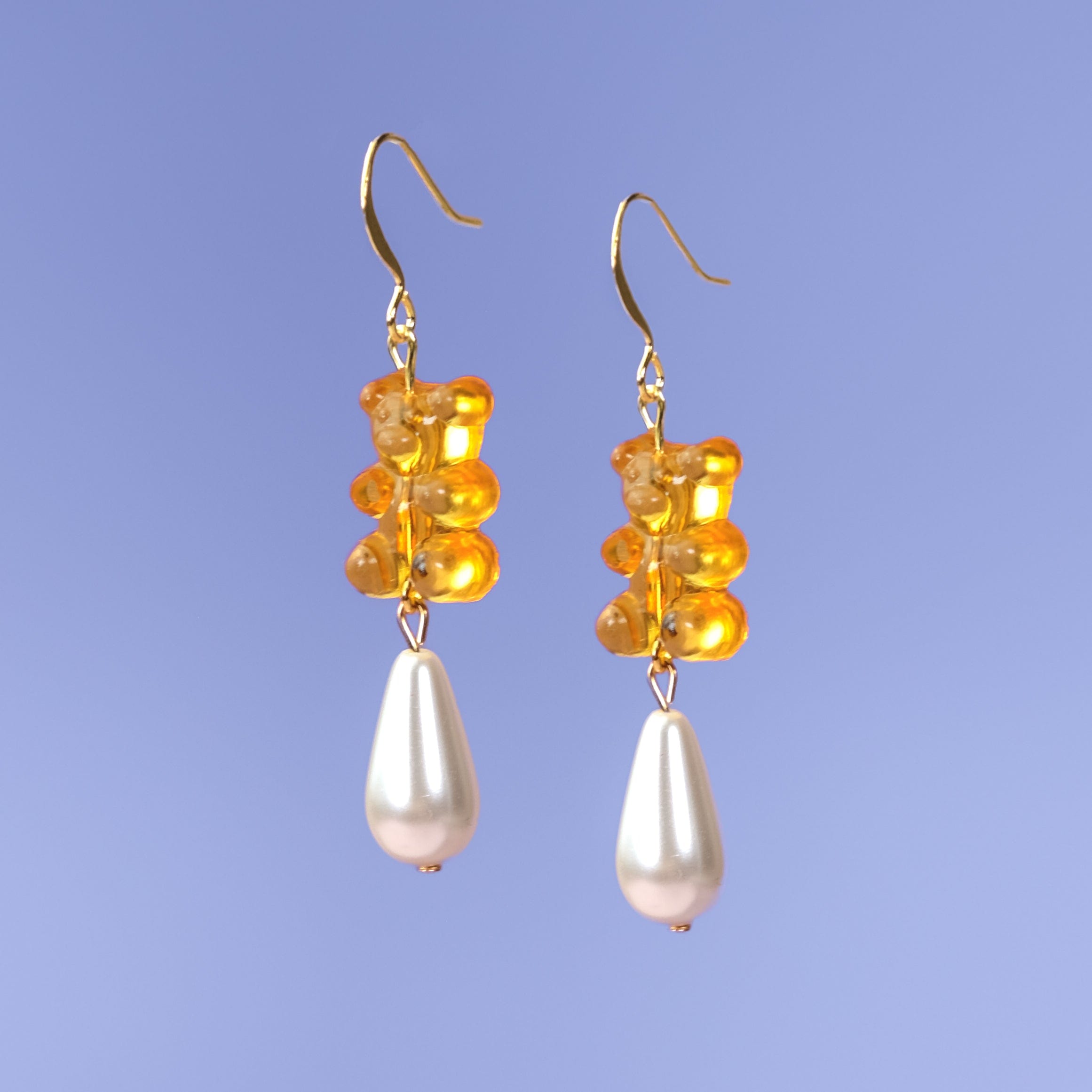 Nostalgic, cute and classy gummy bear dangly earrings with elegant pearl drops #color_orange