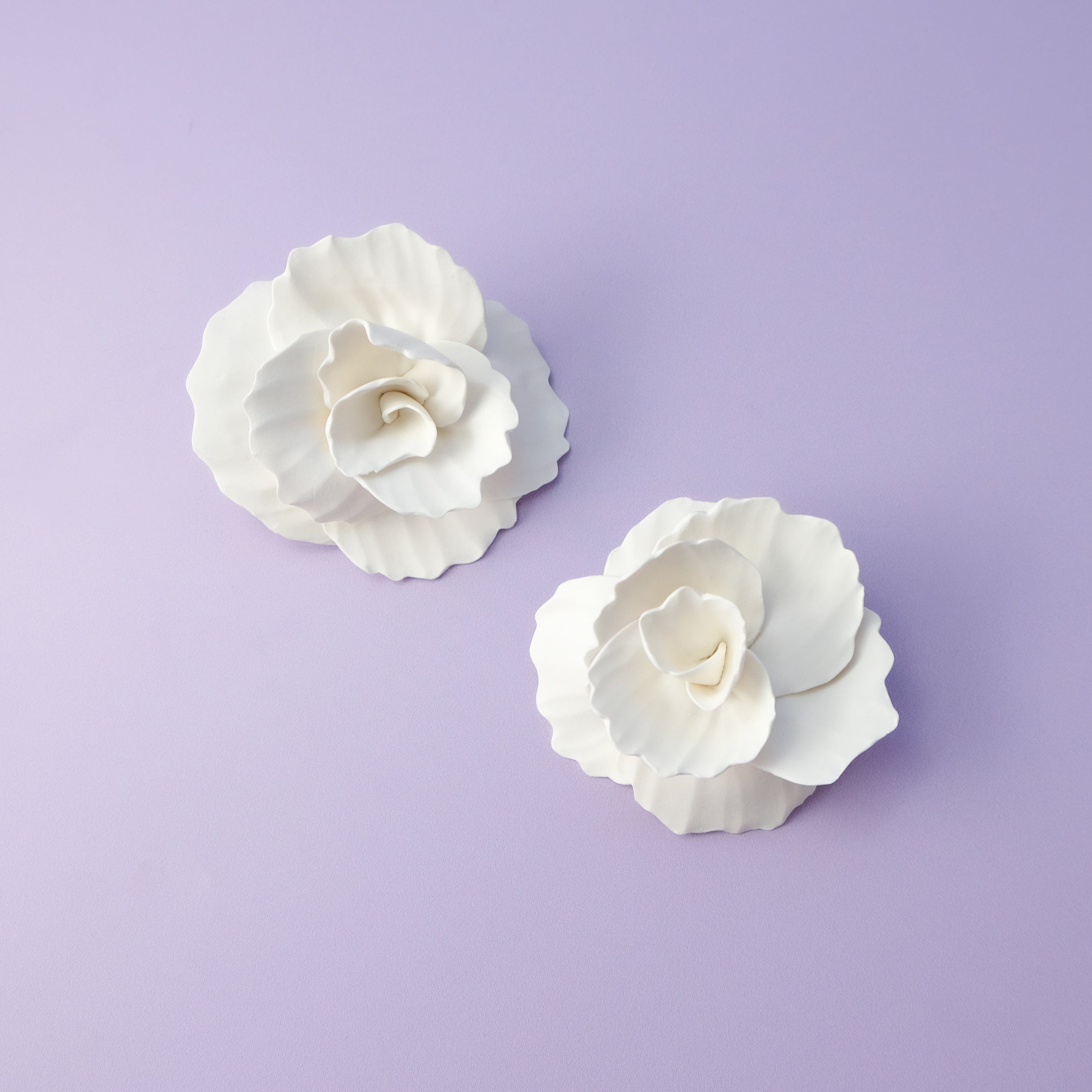 Hand-made statement flower rosette stud earrings in white #color_white