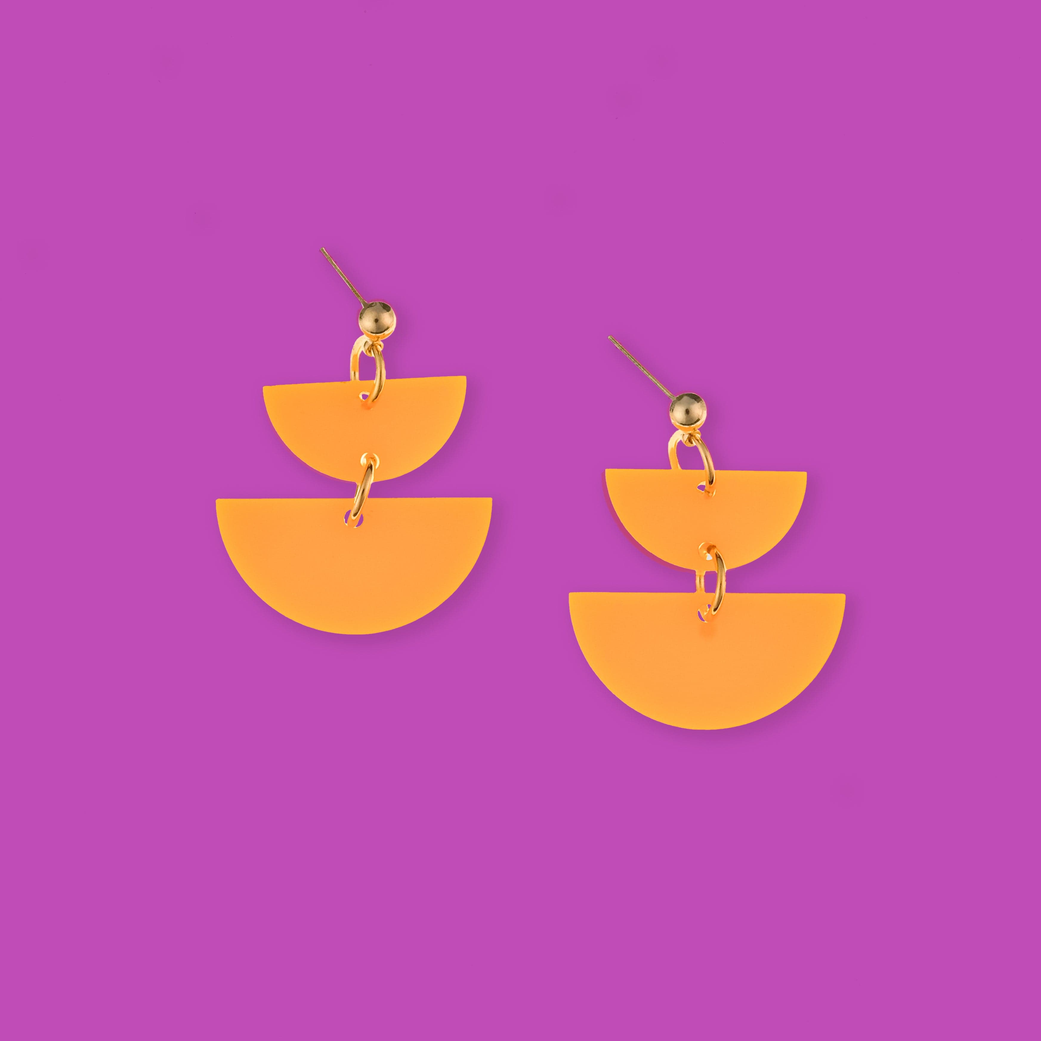 Twin Luna cute dangly half-moon shaped earrings in neon orange #color_neon-orange